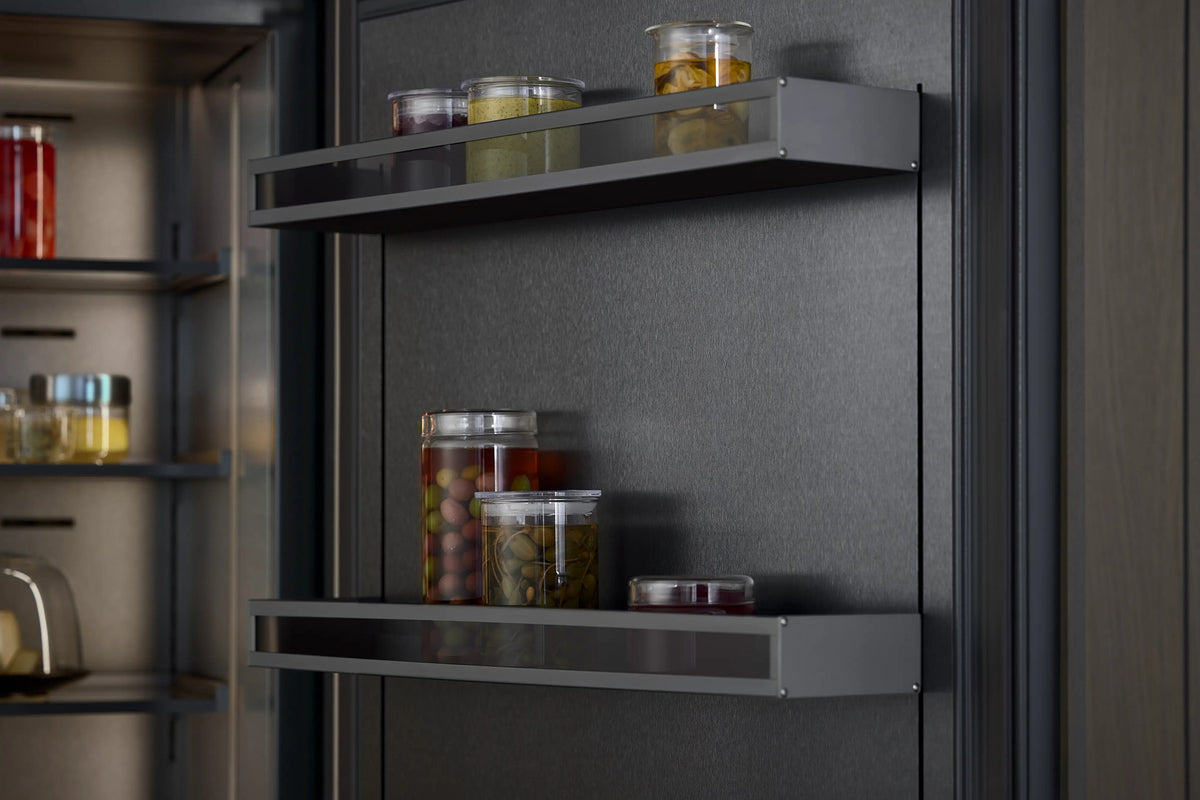 Gaggenau Expressive Series Vario Fridge RVC497190 - interior detail showing LED lighting and glass shelves loaded with food