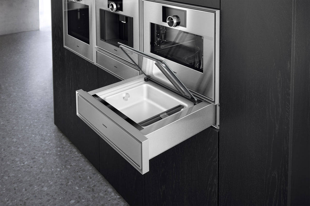 Gaggenau Expressive Series Vacuum Drawer GV051190 - in-use shot with food being vacuum sealed