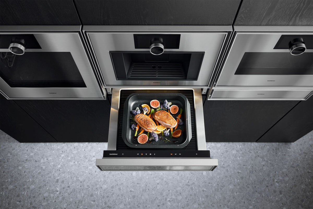 Gaggenau Expressive Series Warming Drawer GW453120 - in-use shot with plates being kept warm inside