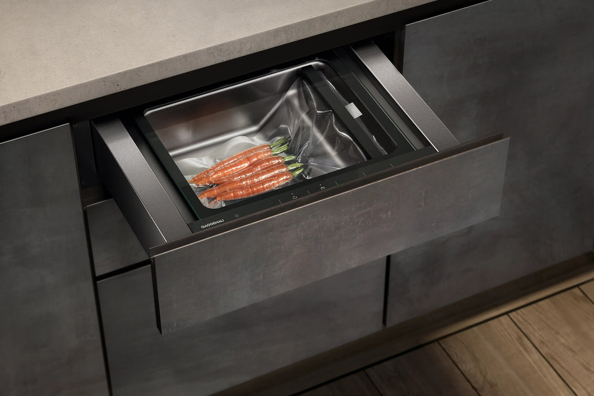 Gaggenau Expressive Series Vacuum Drawer GV051190 - drawer open showing vacuum sealing chamber and accessories