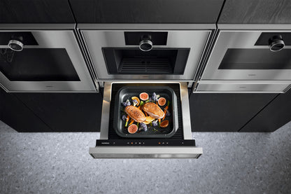 Gaggenau Expressive Series Warming Drawer GW453120 - in-use shot with plates being kept warm inside